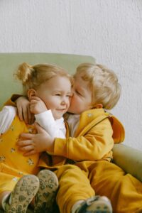 Brother sister hugging each other