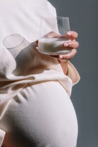 Pregnant woman having milk