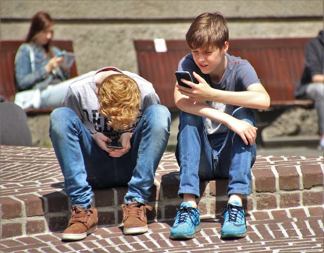 teenagers using mobile